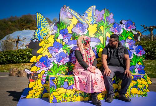 Couple sat on wildflower seat at the Eden Project